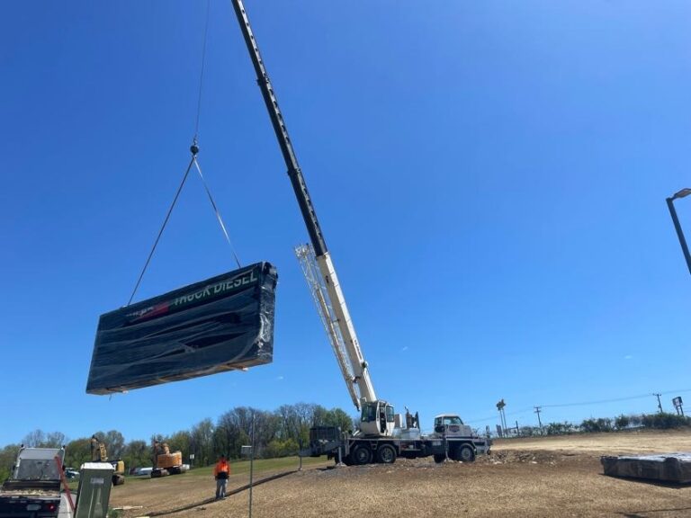 Crane setting an LED sign cabinet