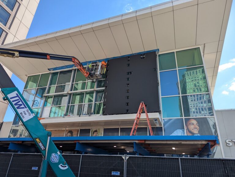 High-rise facade sign installation