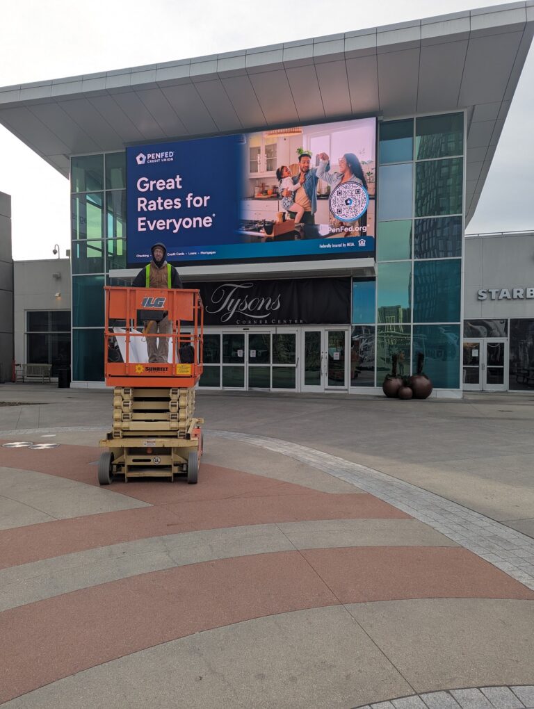 Large-format digital display at a shopping mall entrance