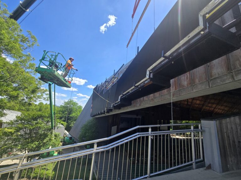 Crew installing the LED video wall from a lift
