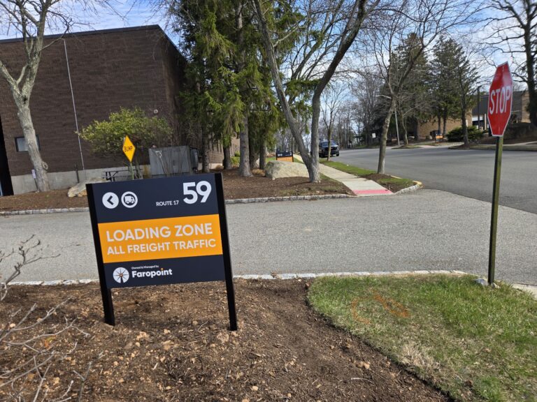 Loading zone directional sign